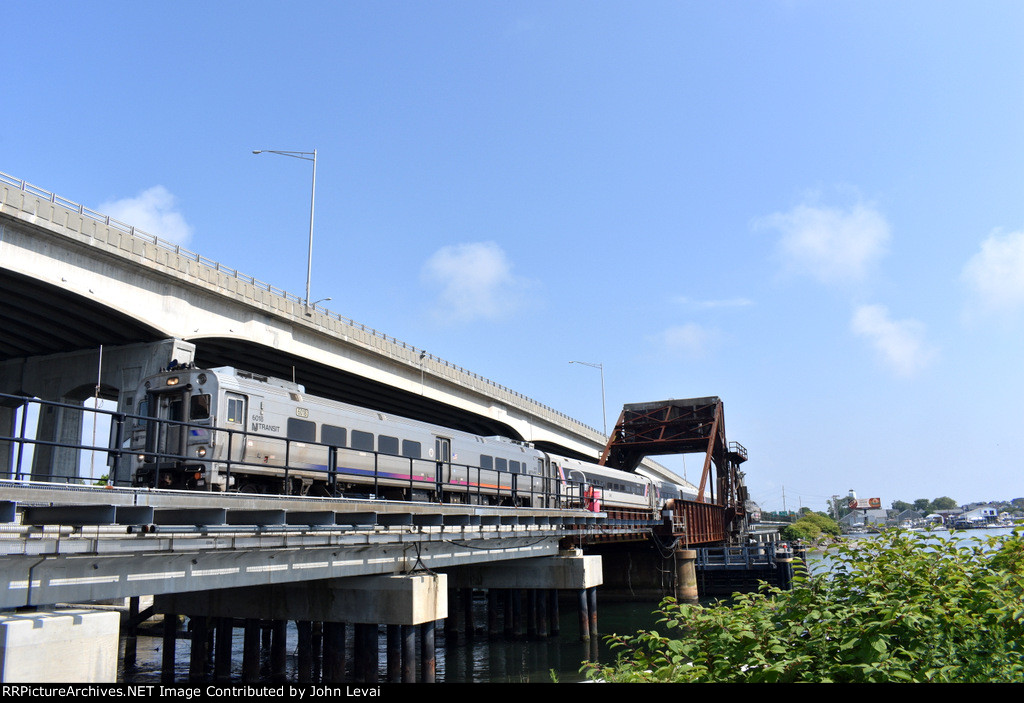 Bay Head bound NJT Train # 4725 crosses the Shark River Drawbridge into Belmar behind NJT Comet V # 6018